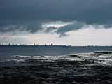 Low tide view across to Portsmouth harbour on a very stormy day